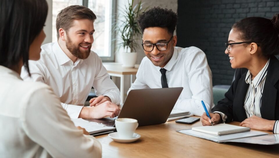 cheerful-young-colleagues-indoors-coworking-min Strategies to Reduce Employee Turnover