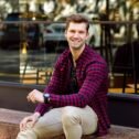 stylish-handsome-young-businessman-sitting-street-amazing-smile-brown-hairs-eyes-wearing-hipster-plaid-shirt-beige-trousers-sunglasses-watches-posing-near-restaurant stylish-handsome-young-businessman-sitting-street-amazing-smile-brown-hairs-eyes-wearing-hipster-plaid-shirt-beige-trousers-sunglasses-watches-posing-near-restaurant